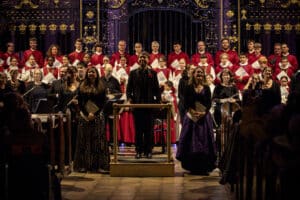 Singers, conductor, orchestra and choir take the applause of the audience at the end of the concert.
