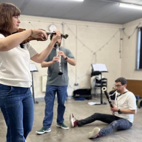 Picture shows three musicians - playing violin, clarinet and bassoon - rehearsing for the performance of the Leap Year children's show