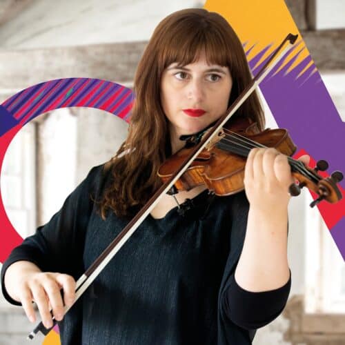 Image shows Sinfonia Viva leader Sophie Rosa performing on a violin